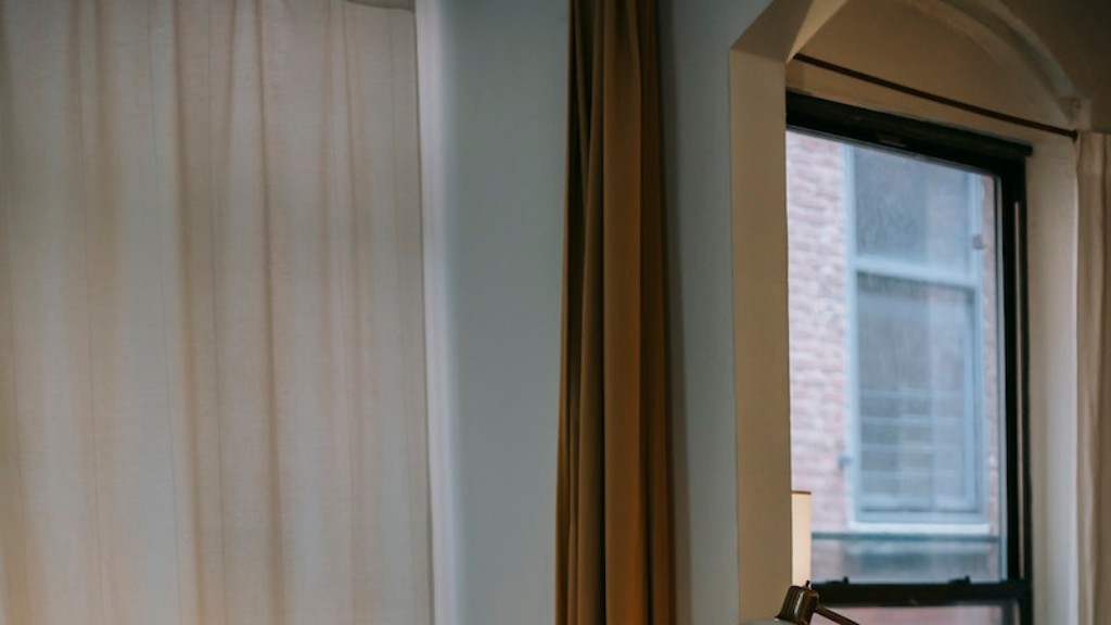 How do i hang curtains over vertical blinds?