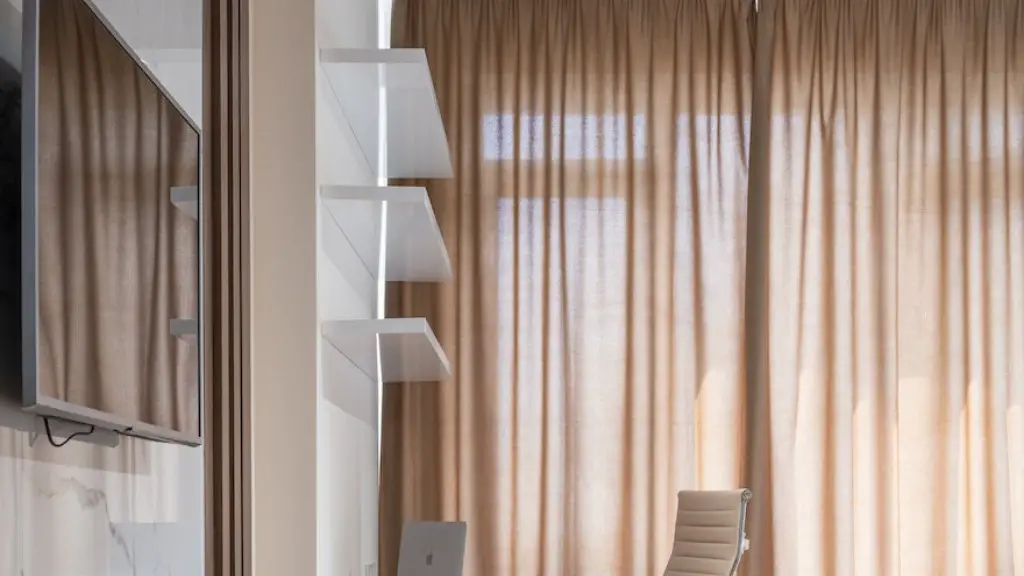 How to hang curtains on vertical blinds?
