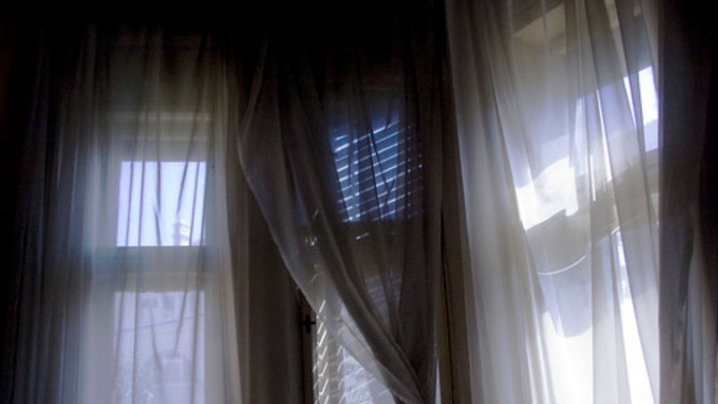 How to pair plantation shutters with curtains?