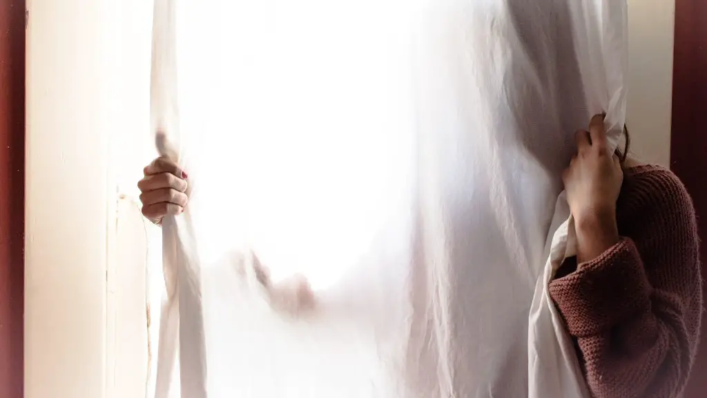 Should curtains touch the ground?